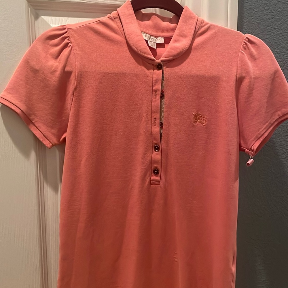 Medium size Burberry polo shirt  has three tiny holes  won’t show if it’s tuck